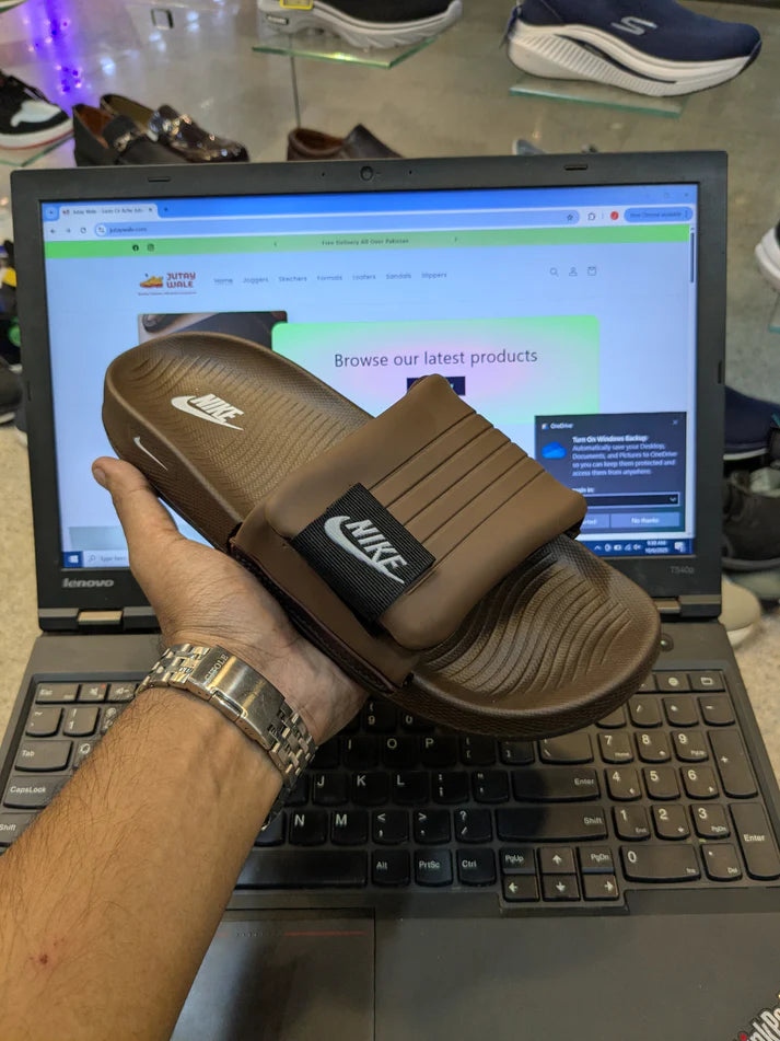 NIKE ADJUSTABLE SOFT SOLE SLIDS BROWN