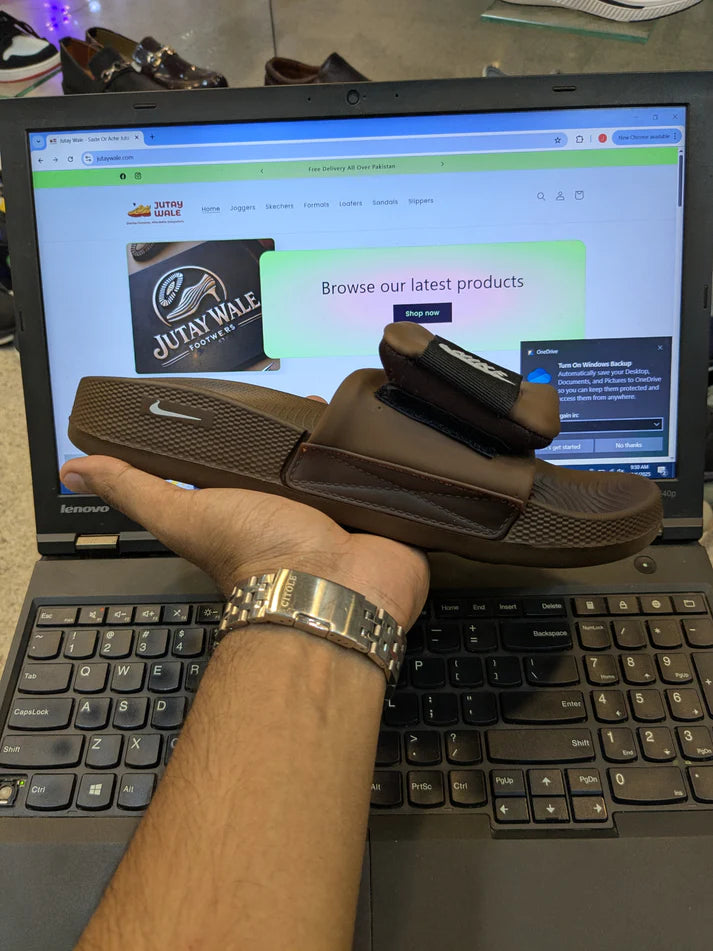 NIKE ADJUSTABLE SOFT SOLE SLIDS BROWN